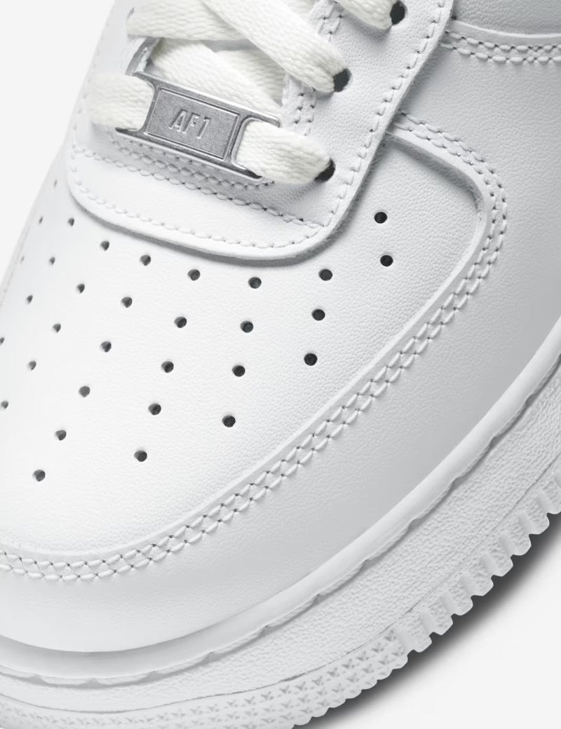 Close-up of a white sneaker with 'AF1' branding on a white background