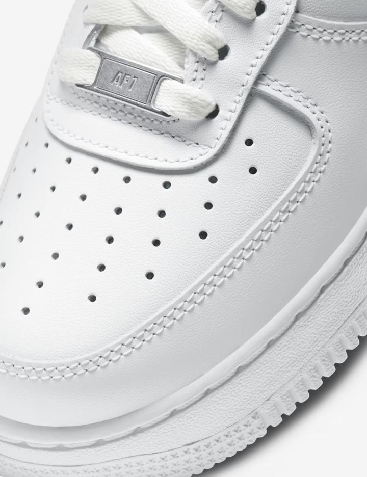 Close-up of a white sneaker with 'AF1' branding on a white background