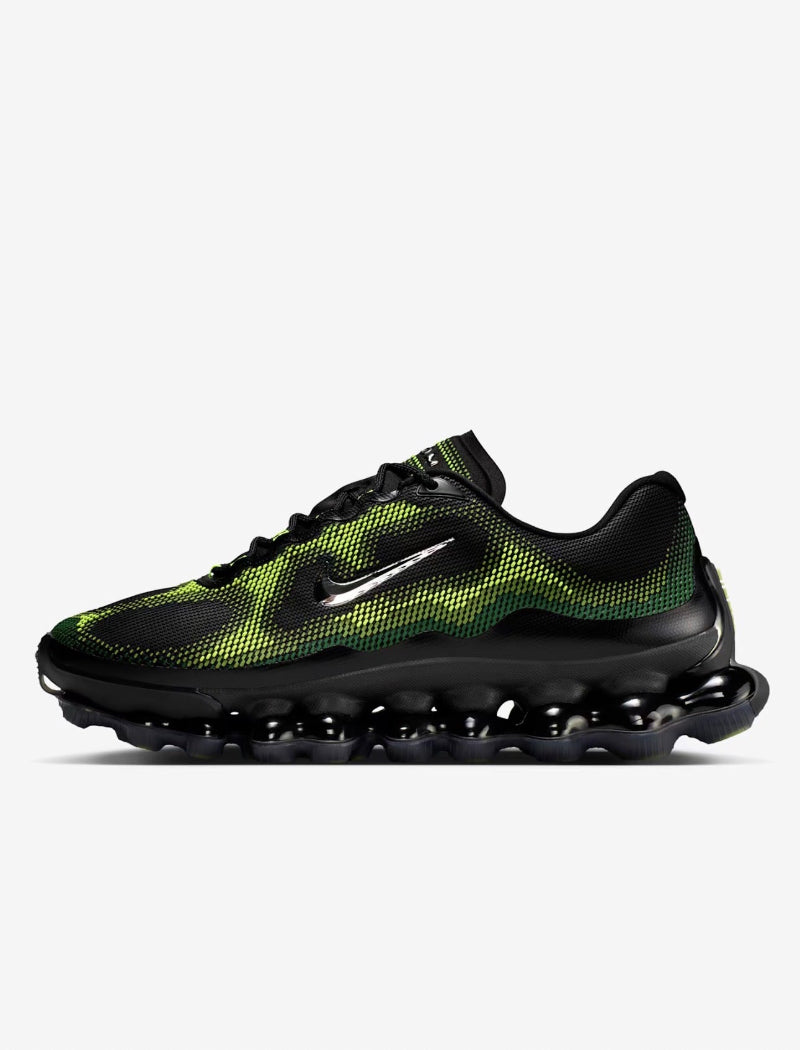 Black and green sneaker with Nike logo on a white background