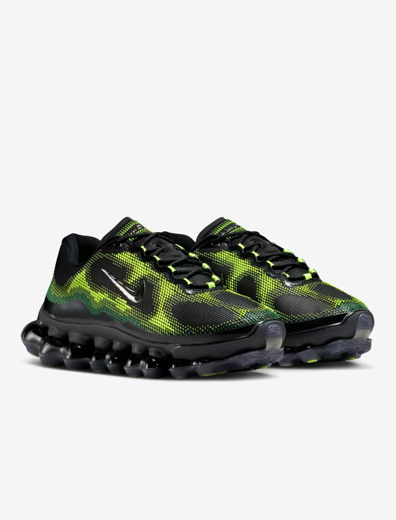 Green and black athletic shoes on a white background