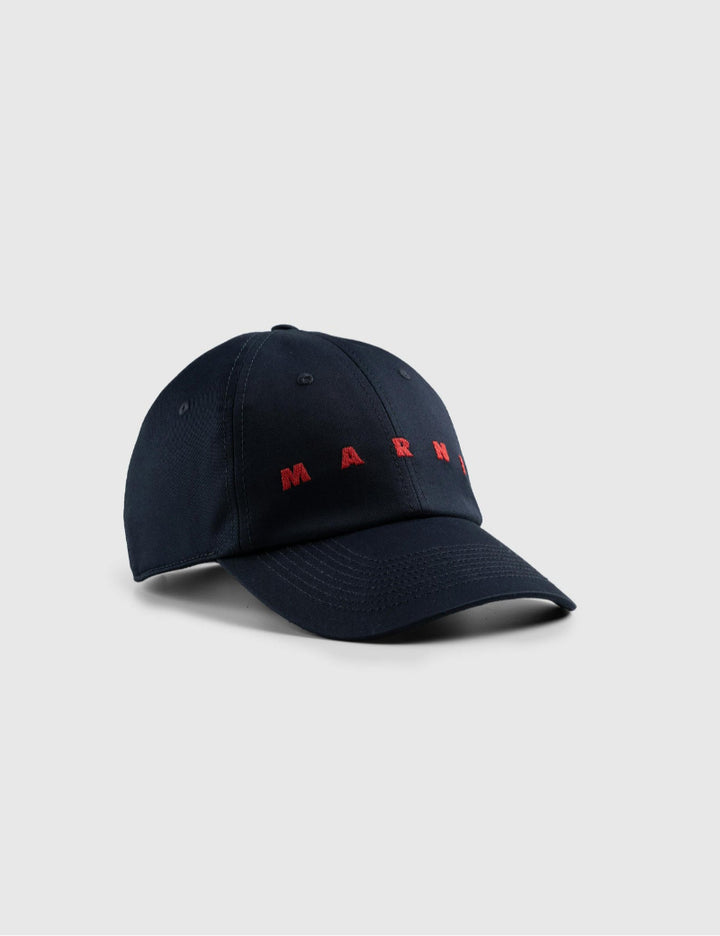 Black cap with red text on a gray background