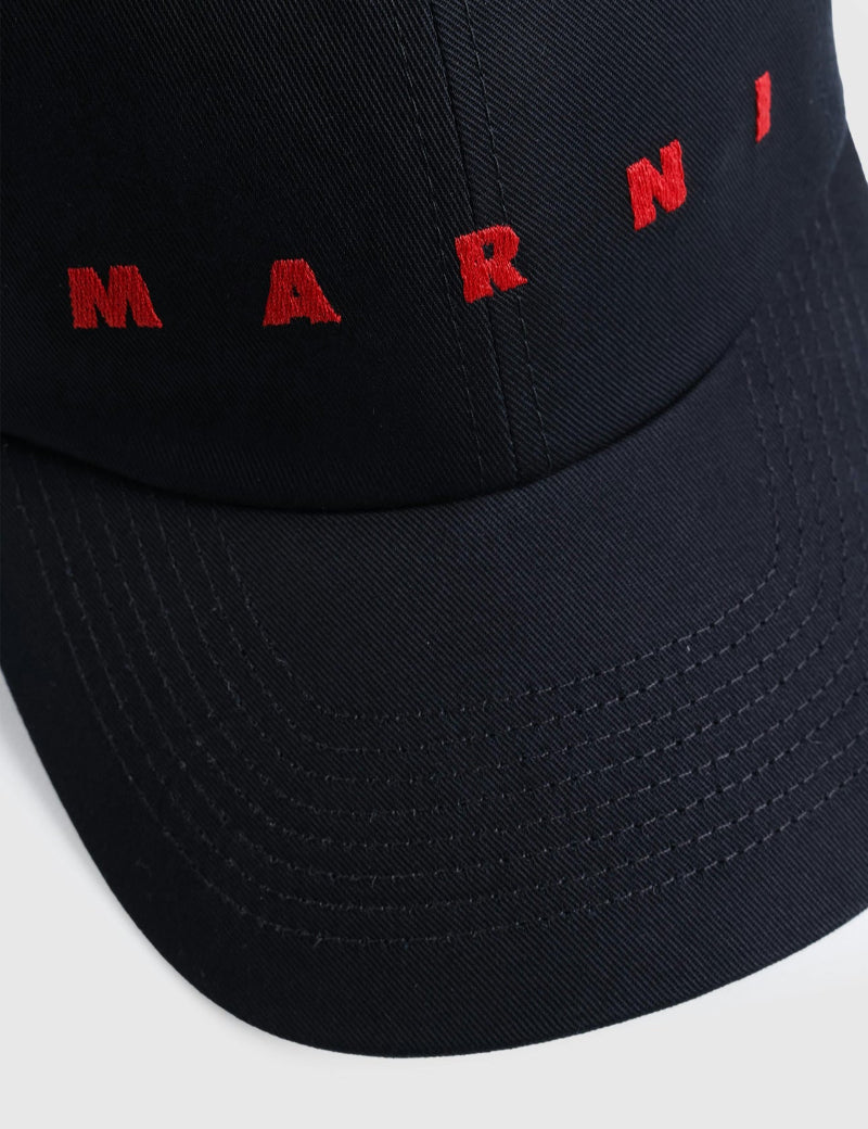 Black bucket hat with red 'MARNI' embroidery on a white background